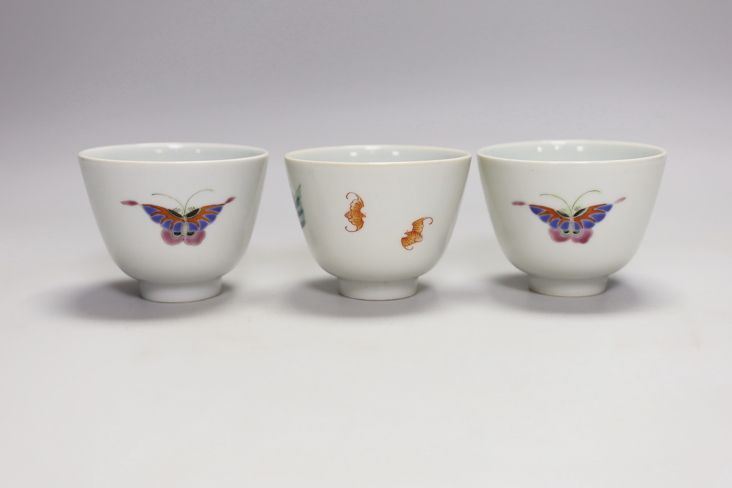 Three Chinese famille rose 'immortals' cups, 6cm tall